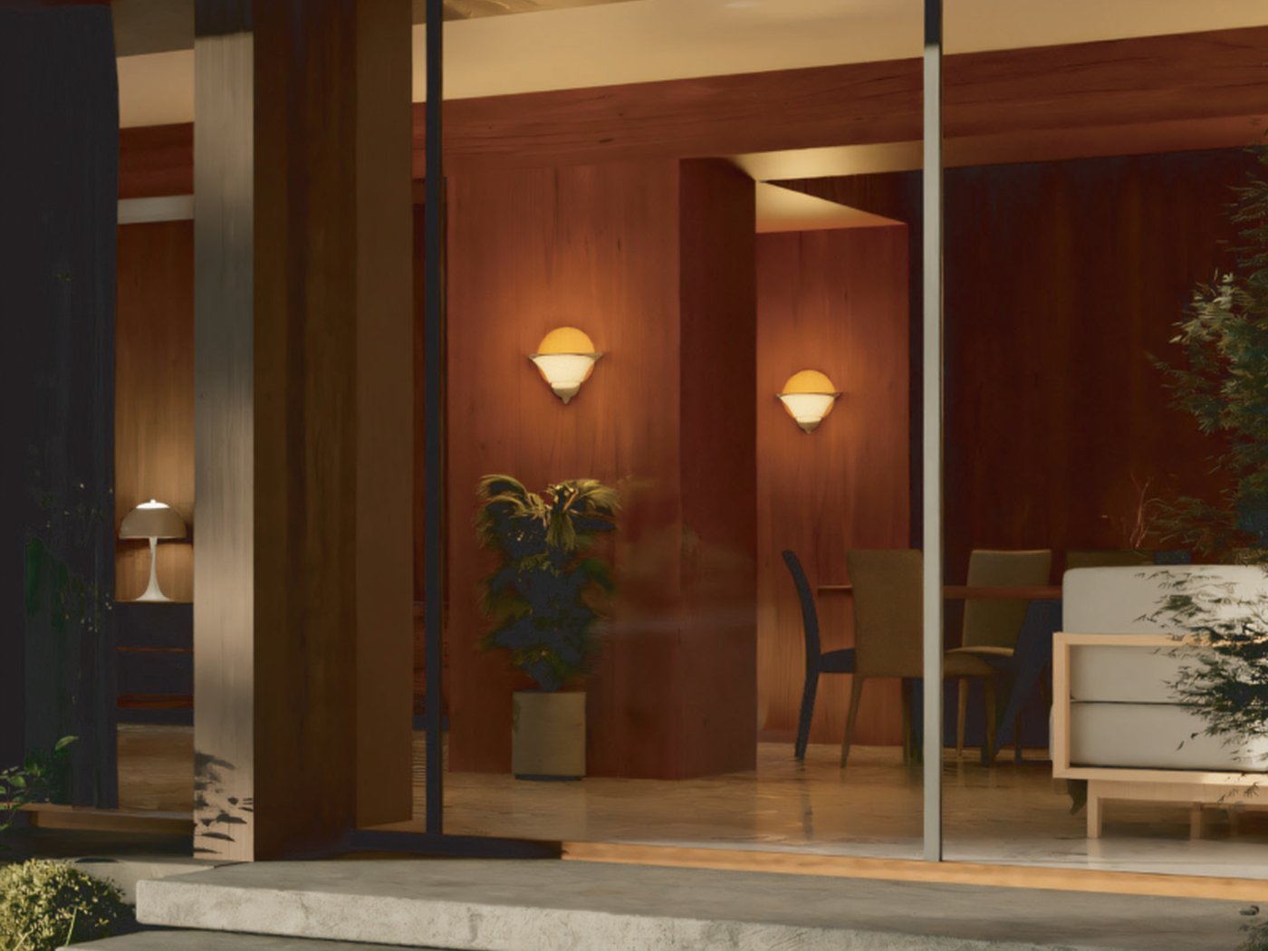 Timber-clad lobby seen through full-height glazing at dusk
